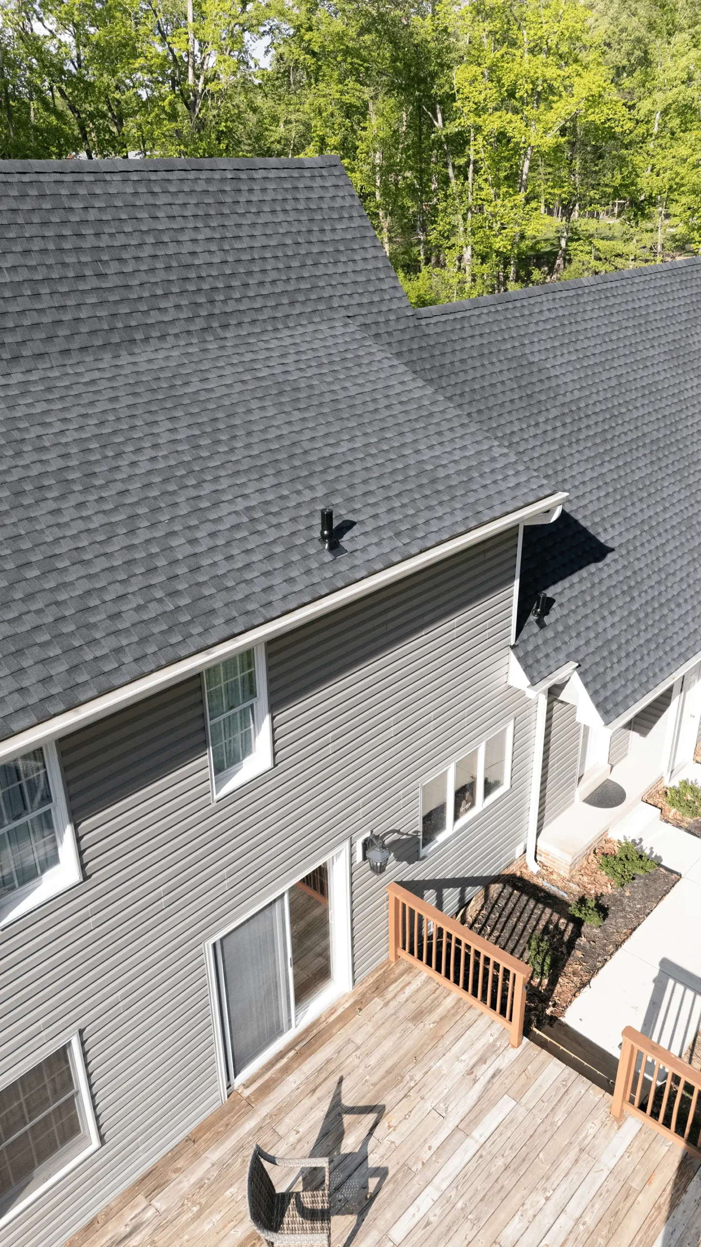 Roof Inspection Services Southern Maryland technician inspecting residential roof for damage