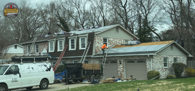 Professional contractor inspecting a roof and preparing a Roof Replacement Cost MD estimate for a Maryland homeowner.
