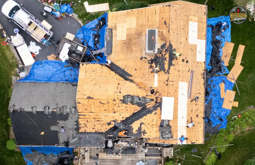 Roofing Contractor Chesapeake Beach MD discussing roofing cost with homeowner