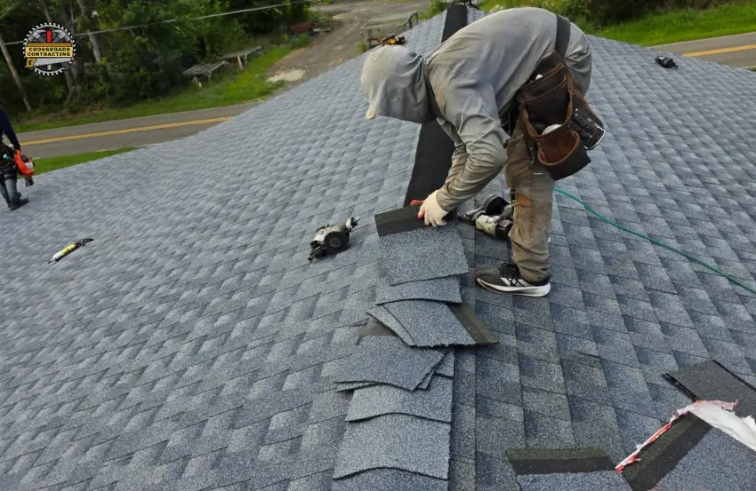 Roofing Contractor Prince Frederick MD inspecting and repairing a residential roof